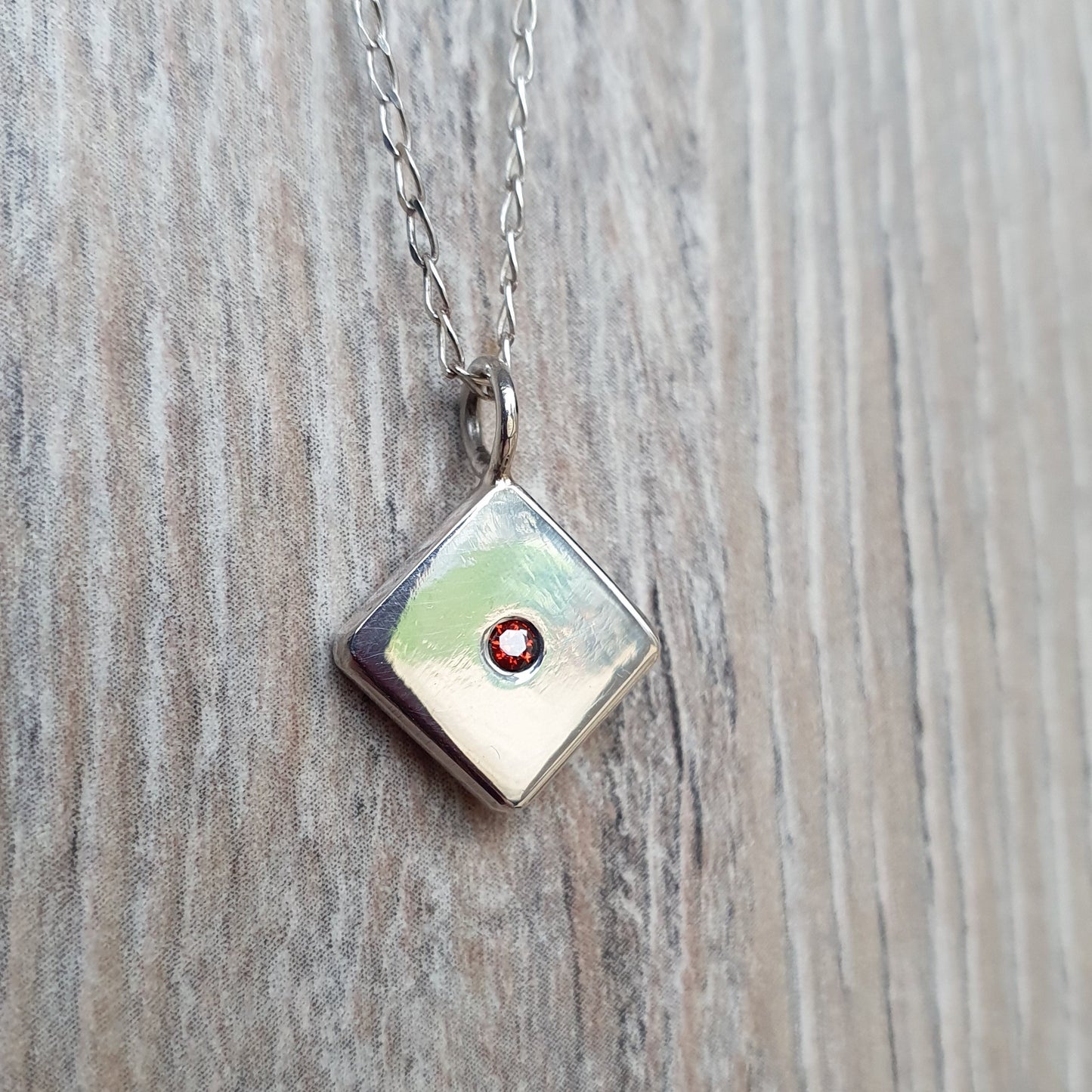 Square pendant with Red Cubic Zirconia flush set stone