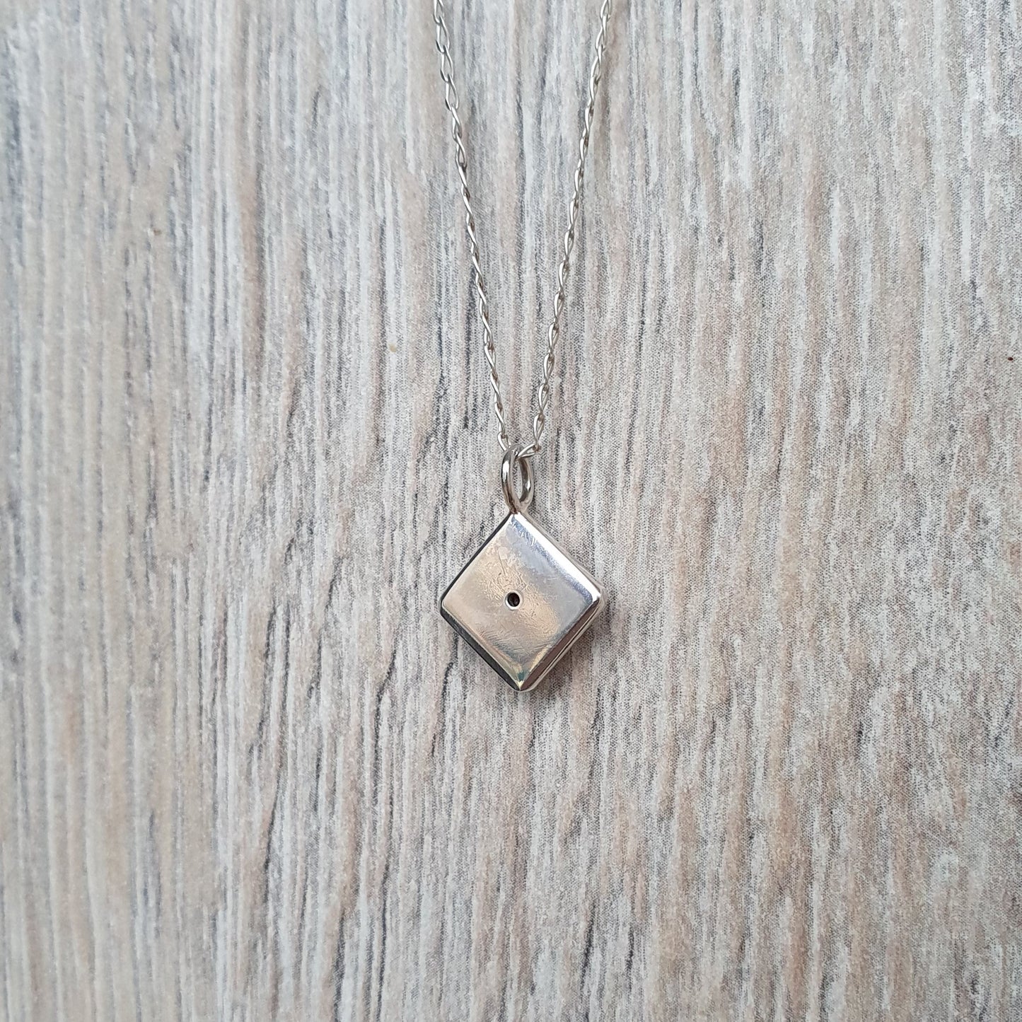 Square pendant with Red Cubic Zirconia flush set stone