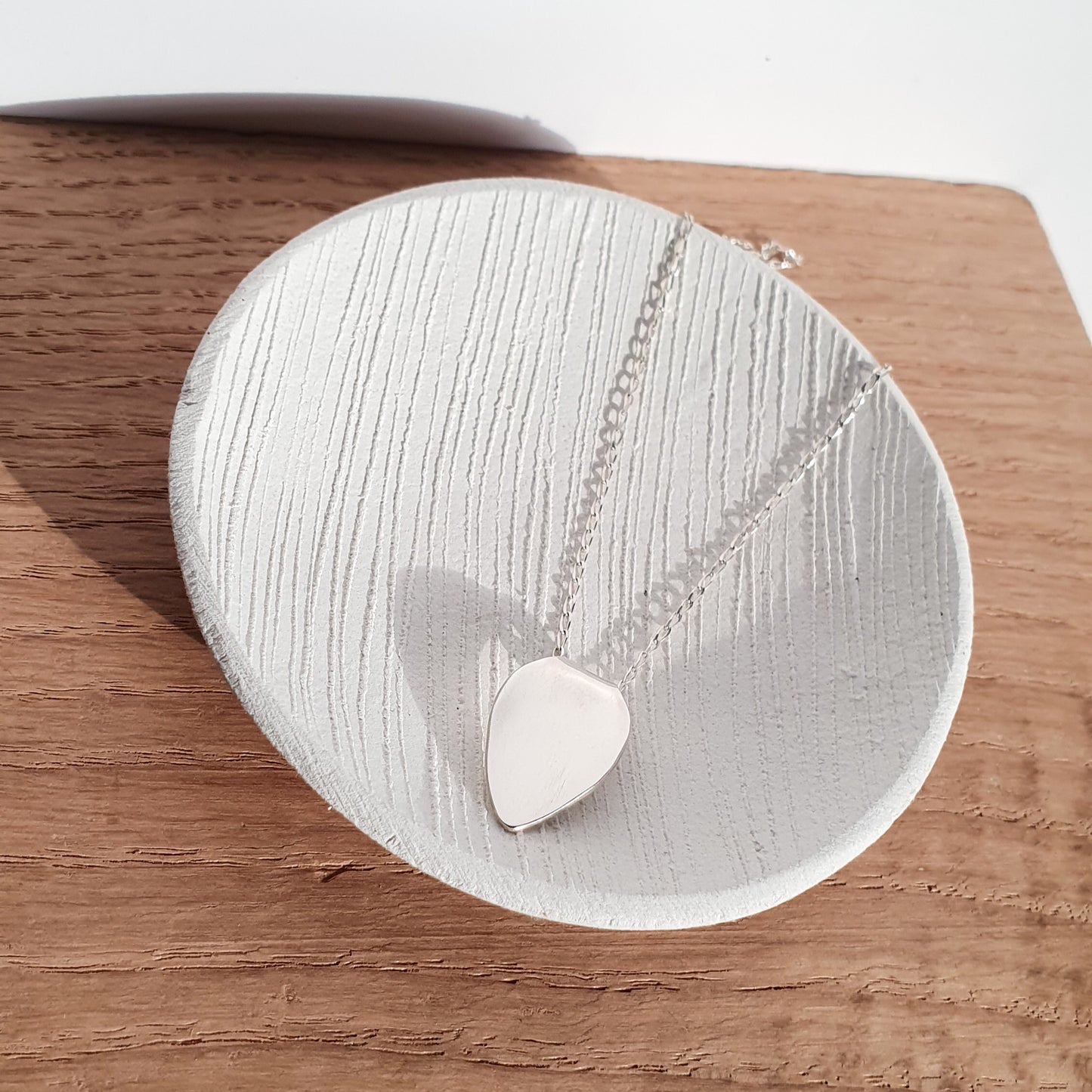 Polished petal pendant