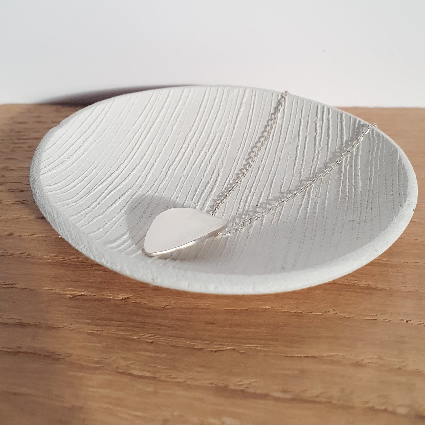 Polished petal pendant