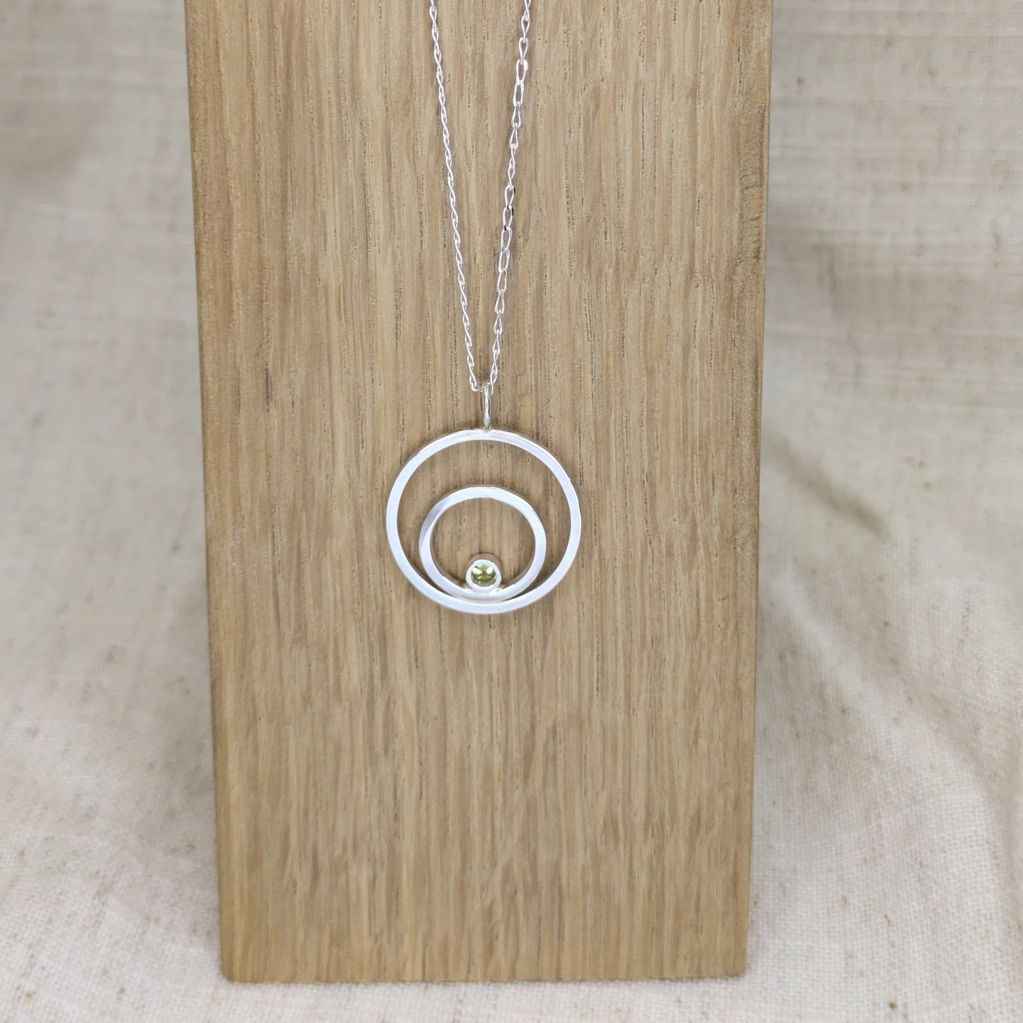 Double ring pendant with 3mm tube set Green Cubic Zirconia
