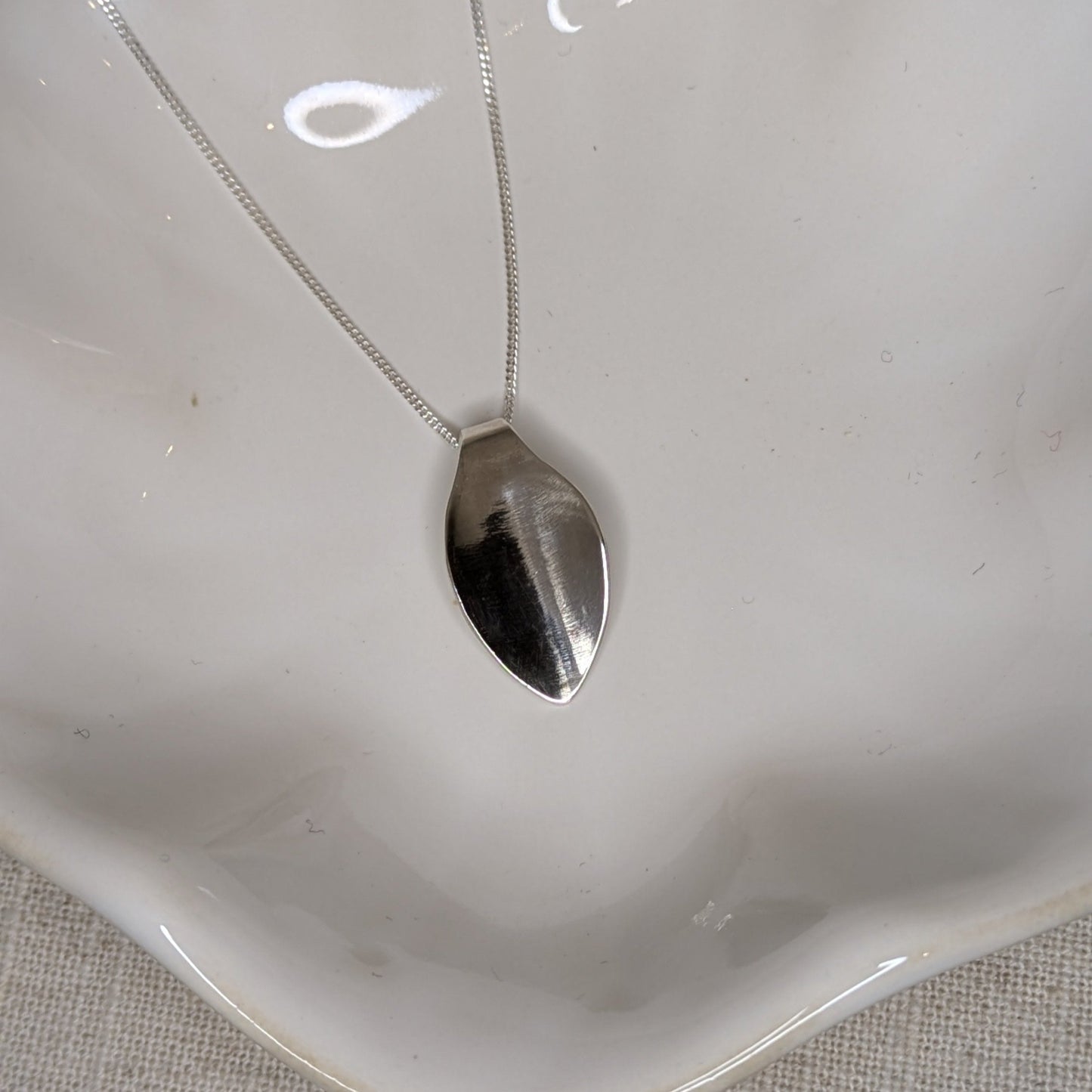 Polished petal pendant