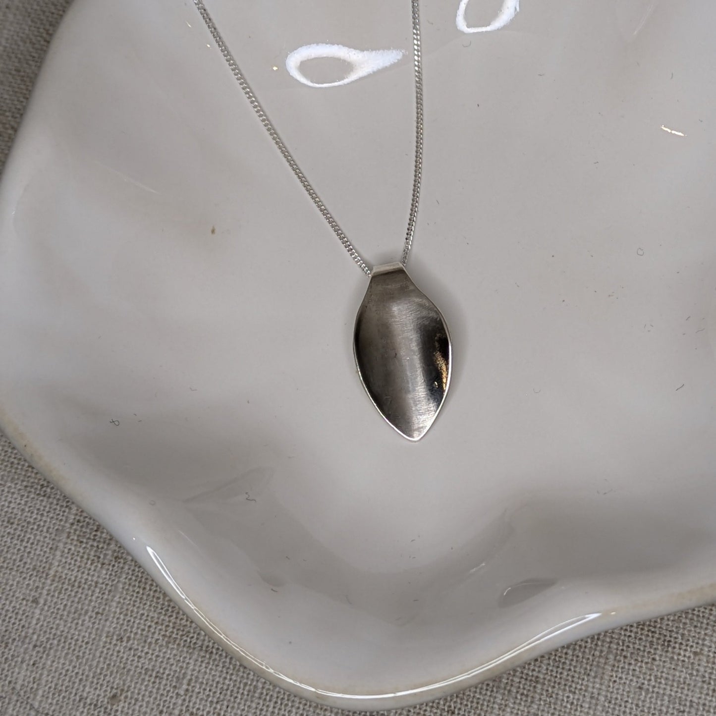 Polished petal pendant