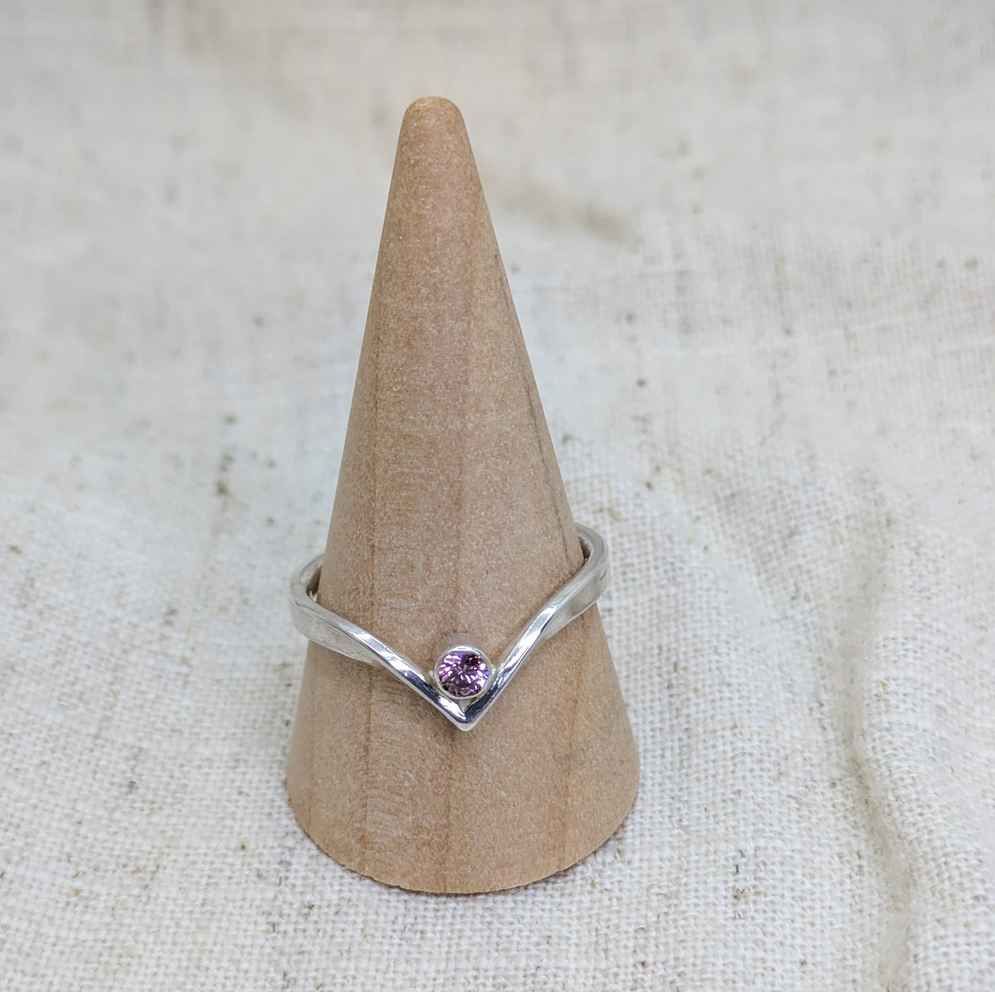 Sterling silver wishbone ring with a 3mm tube set pink Cubic Zirconia