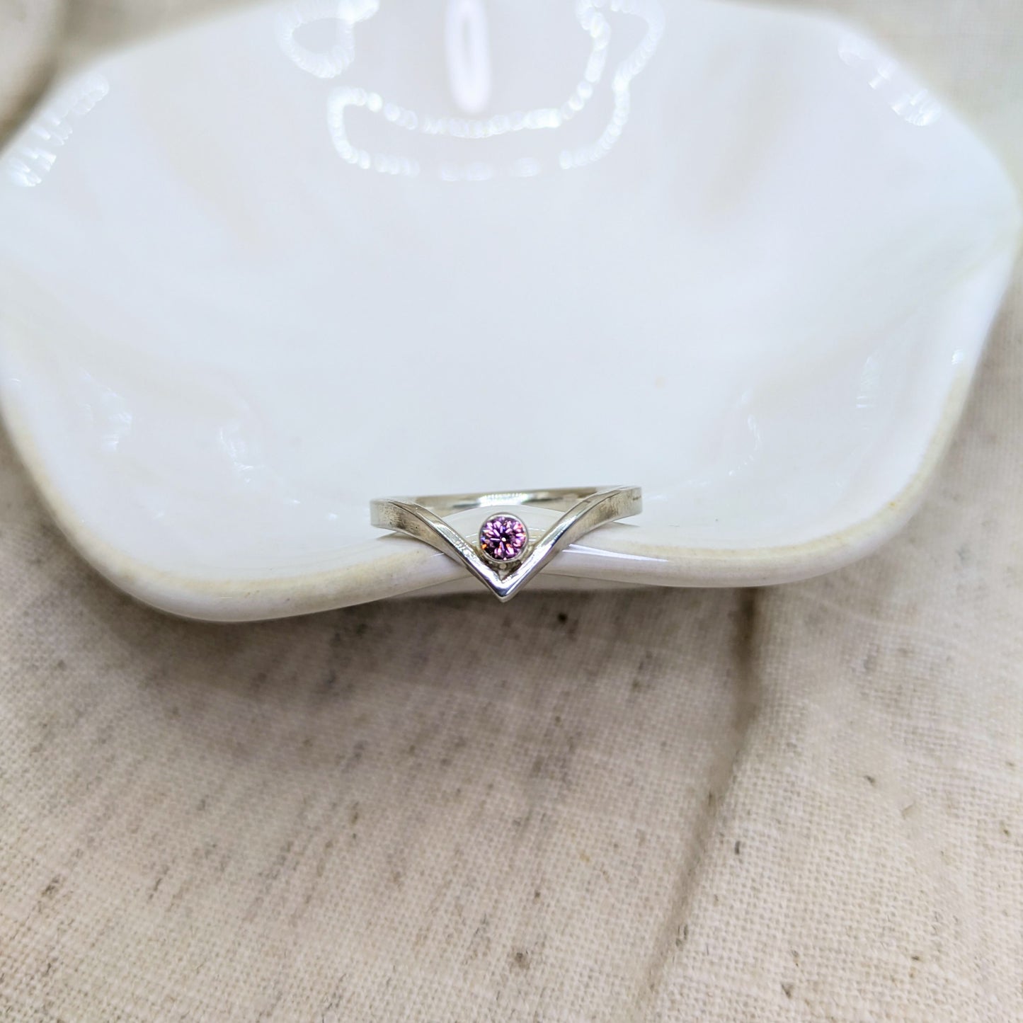 Sterling silver wishbone ring with a 3mm tube set pink Cubic Zirconia