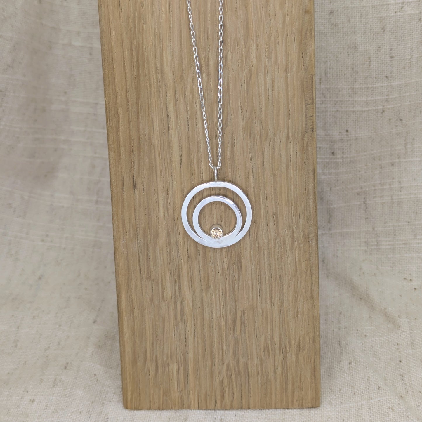Double ring pendant with 3mm tube set Champagne Cubic Zirconia