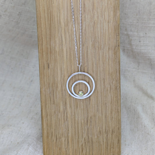 Double ring pendant with 3mm tube set Green Cubic Zirconia